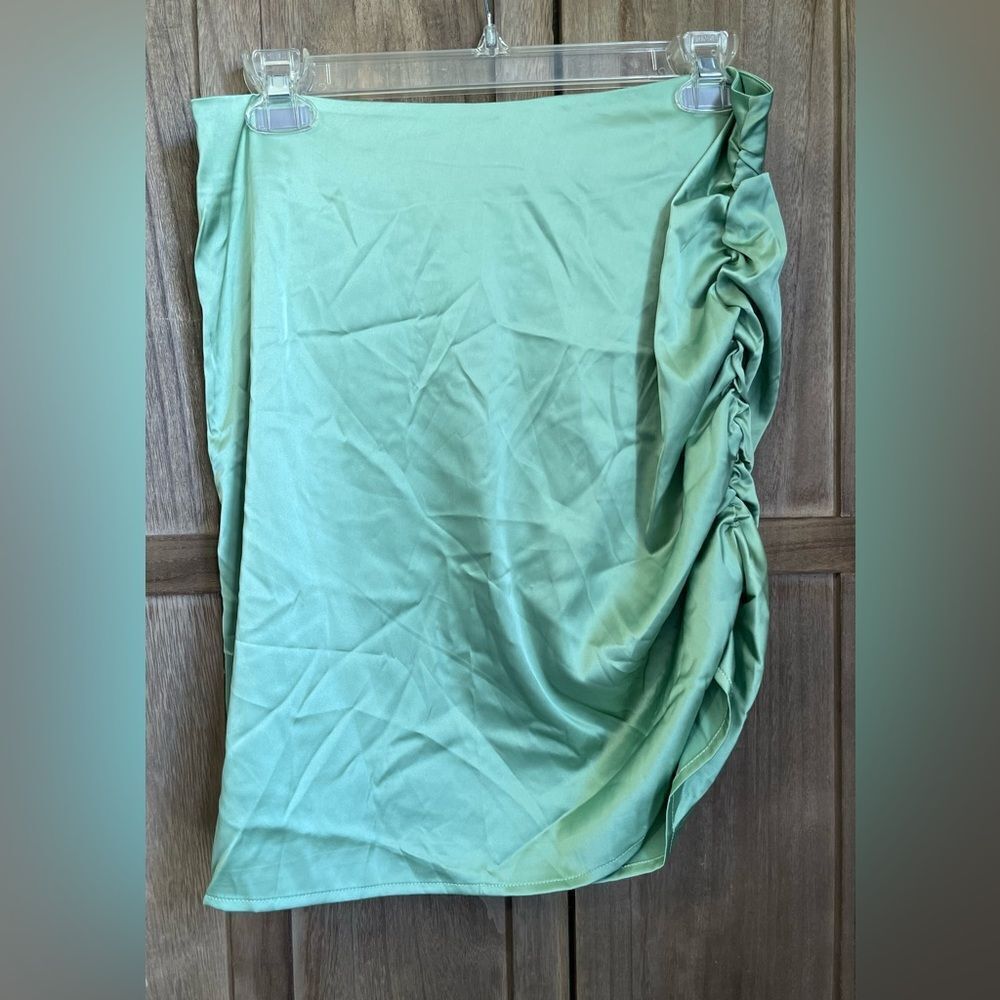 NWT.  Cider Women’s green satin mini skirt.